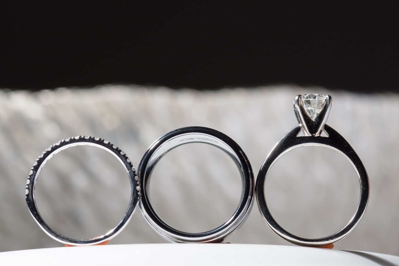 From the left: pave band, wedding band, and a round cut diamond ring
